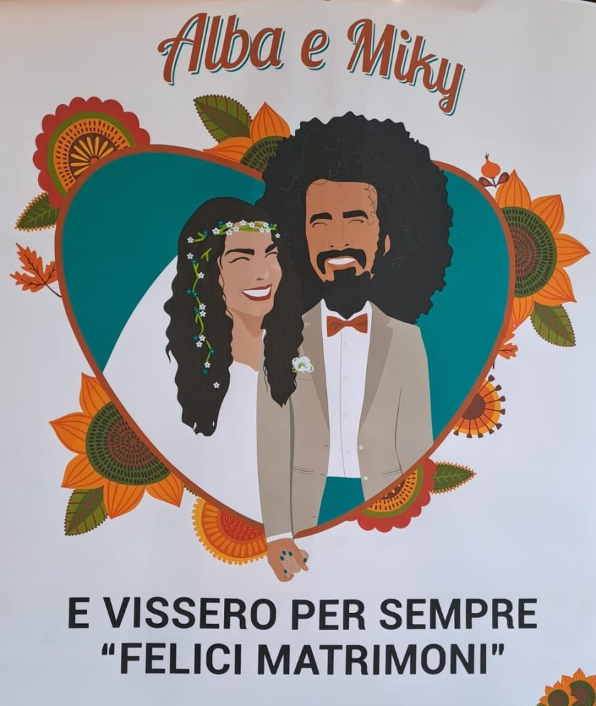 Caparezza e Alba illustrati in un manifesto per il loro matrimonio