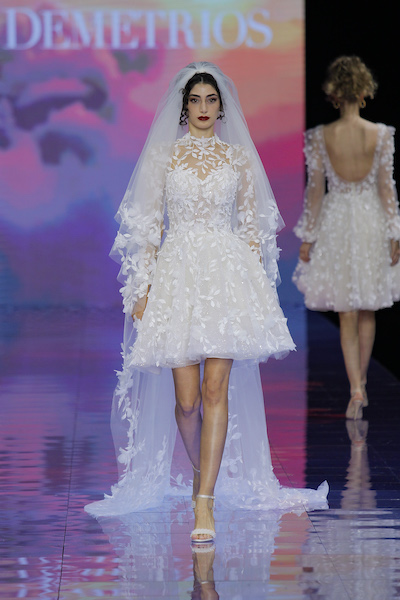 In questa foto un abito da sposa corto  di Demetrios Bridal 2024
